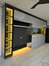 Customised TV feature wall with shelving, lights and kitchen cabinet
